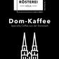 Verpackung des Altstadt Rösterei Dom-Kaffee, Spezialkaffee aus der Domstadt, mit Abbildung des Kölner Doms und dem Hinweis "10% der Einnahmen spenden wir zum Erhalt des Kölner Doms".