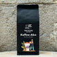 Schwarze Kaffeeverpackung von True Beans mit Etikett ‚Kaffee-Abo‘ – 70 % Arabica, 30 % Robusta, Geschmacksnoten von Haselnuss, Karamell und Beeren. Frisch gerösteter Spezialitätenkaffee aus nachhaltigem Anbau, erhältlich im Kaffee-Abo im True Beans Online-Shop.